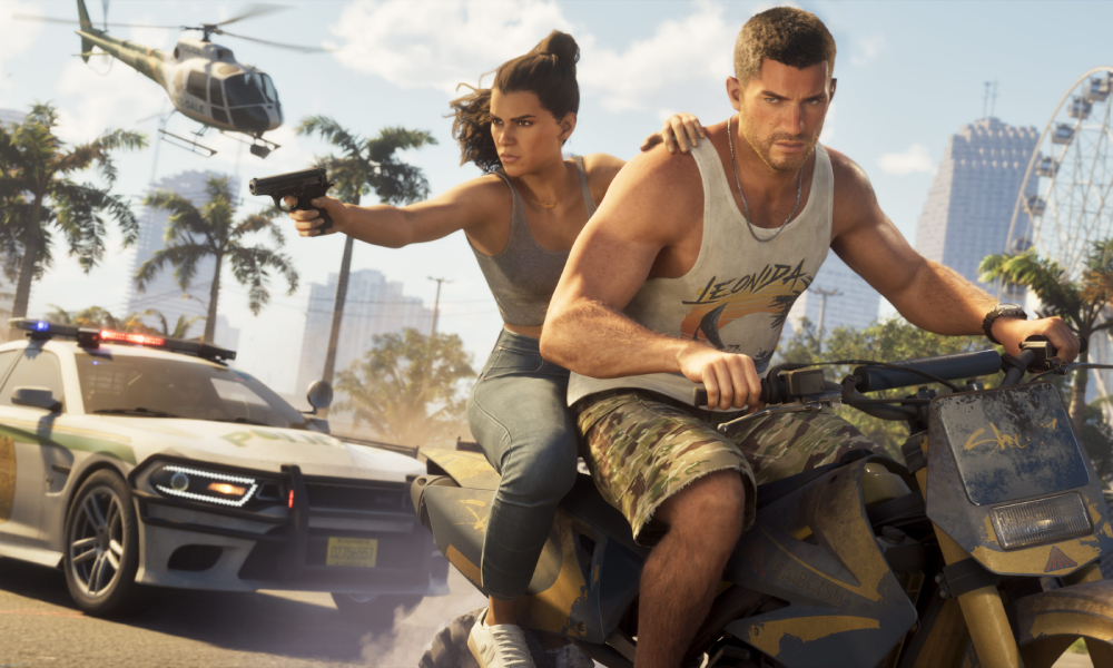 Lucia and Jason riding a motorcycle while a police car and a helicopter chase them in Grand Theft Auto VI
