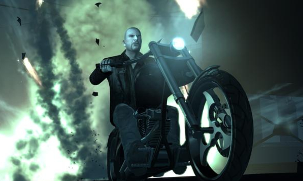 Johnny Klebitz riding a chopper motorcycle in front of an explosion in GTA IV: The Lost and Damned