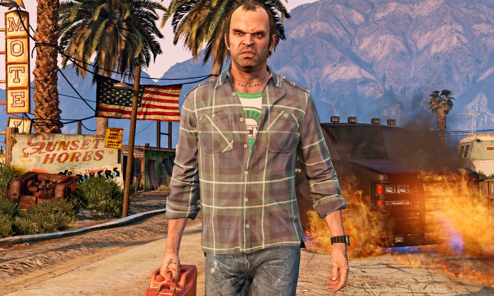 Trevor Philips carrying a red fuel can in front of a burning vehicle and a motel sign in Grand Theft Auto V